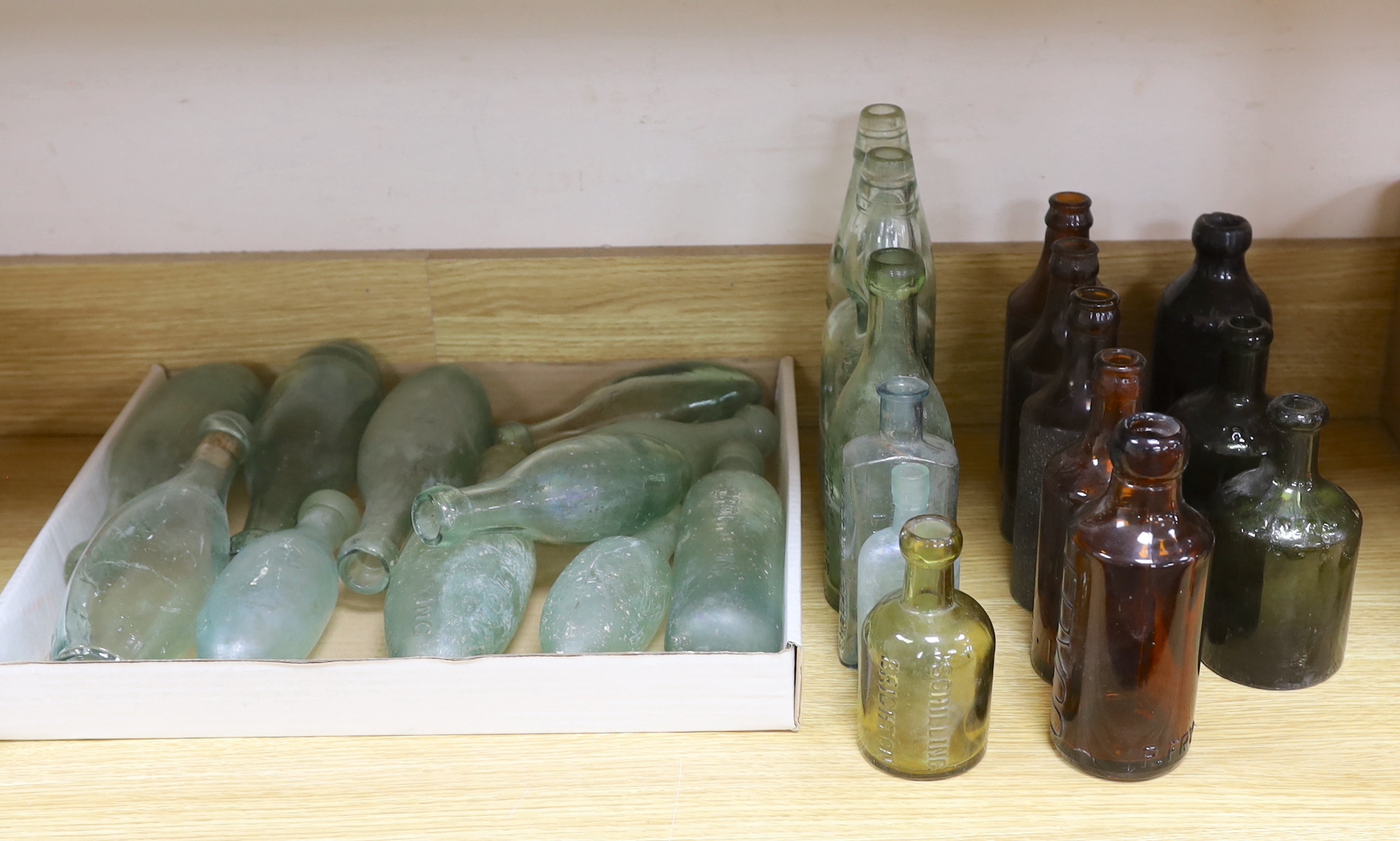 A quantity of early to mid 20th century glass bottles